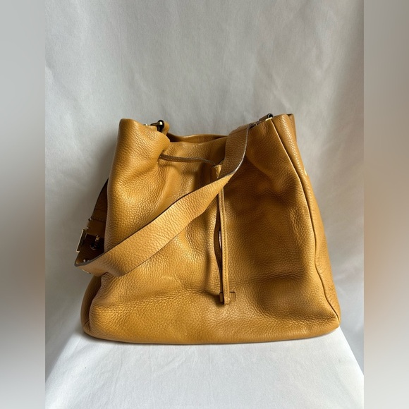 Prada Handbags - Prada yellow pebbled leather Bucket Bag